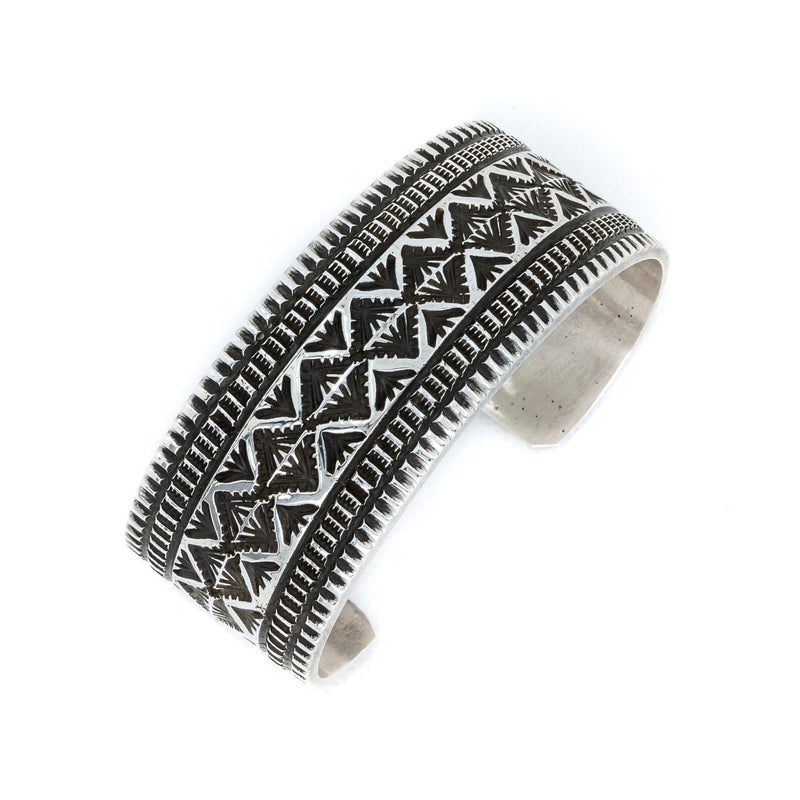 Traditional southwestern style  sterling silver stamped cuff bracelet. Native American Indian Artist: Maloney, Navajo.