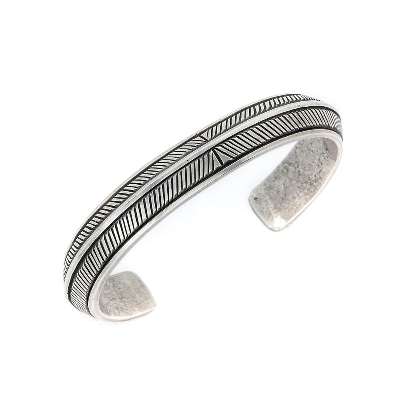 Men's southwestern style sterling silver cuff. Native American Indian Artist: Calvin Martinez, Navajo.