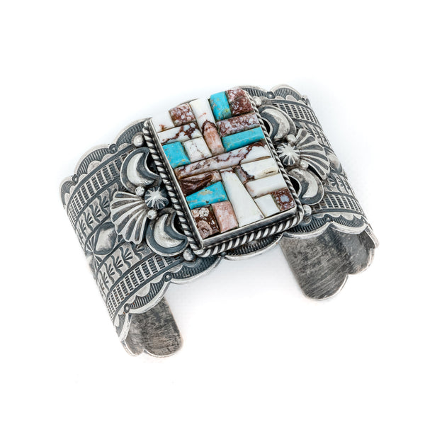 Hand stamped Sterling Silver, Kingman Turquoise and Wild Horse create stunning and unique Native American jewelry. Artist: M. Spencer, Navajo 