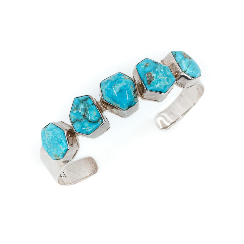 The unique shape of these Kingman Turquoise stones add a unique one-of-a-kind quality to southwest jewelry style. Artist: P Smith