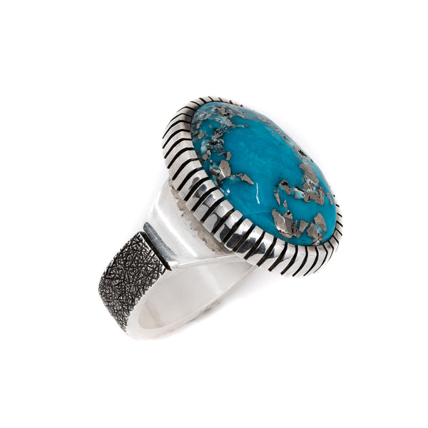 The unique matrix in this Persian Turquoise ring make truly one-of-kind. Artist: Craig Agoodie, Navajo. Persian Turquoise set in sterling silver.
