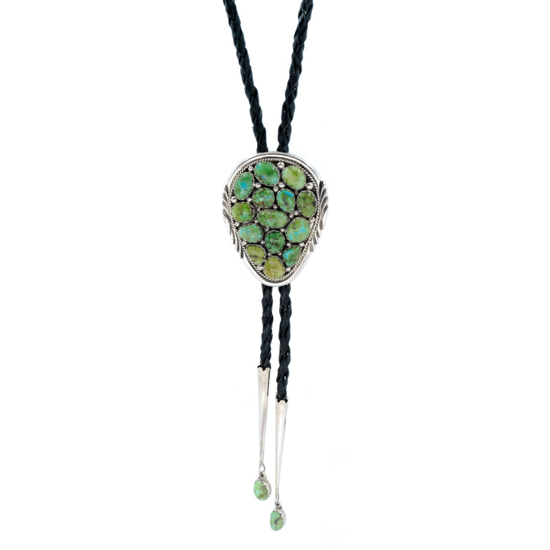 Native American Indian jewelry bolo tie made of Sterling Silver, authentic Sonoran Gold Turquoise and braided leather cord. Artist: Spencer, Navajo 