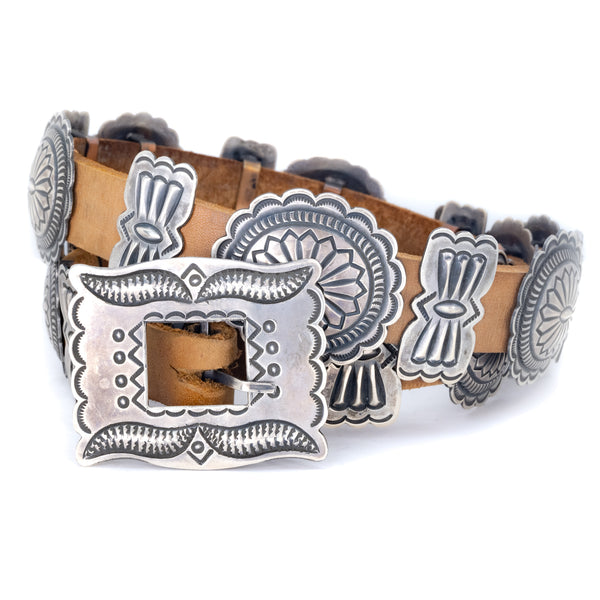 Traditional southwest style Sterling Silver on brown Cowhide leather belt. American Indian Artist: Roger Skeet, Navajo.